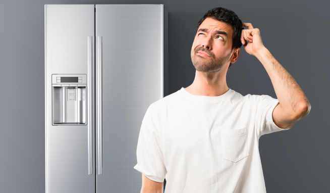 A confused man has noticed that his fridge freezer is showing signs that it might be broken or dying.