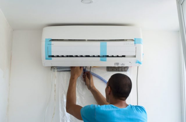 ENERGY man installing new ac shutterstock 291265688 e1534370186720 - Air Conditioning & Refrigeration Specialists - ADK Kooling